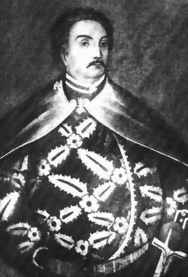 Schwarzes und weißes Foto von Papst Johannes Paul II. in Priesterrobe, der eine schwarze Robe mit weißem Kragen und Manschetten trägt und die Hände gefaltet hat, ernster Gesichtsausdruck, direkter Blick.