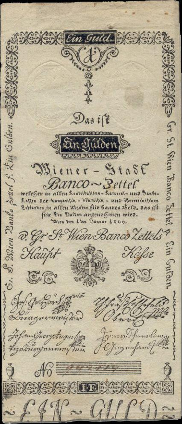 Alte deutsche Banknote mit schwarzem Hintergrund, ein Männergesicht und der Text "St. Wien - Stäse Banco-Settel".