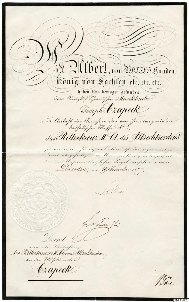 Ein altes Dokument mit einem schwarzen Rand und einem weißen Hintergrund, das den Text "Ritterkreuz II, Dresden, Deutschland" und ein Logo zeigt, das die deutsche Regierung darstellt.